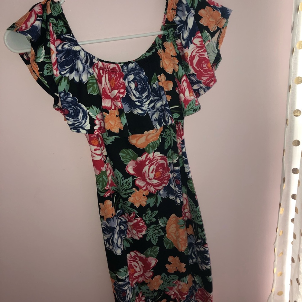 Tight fitted flower dress .